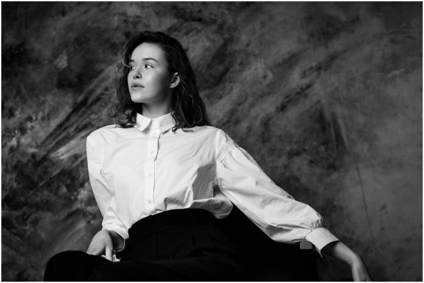 A striking black and white portrait of a woman in