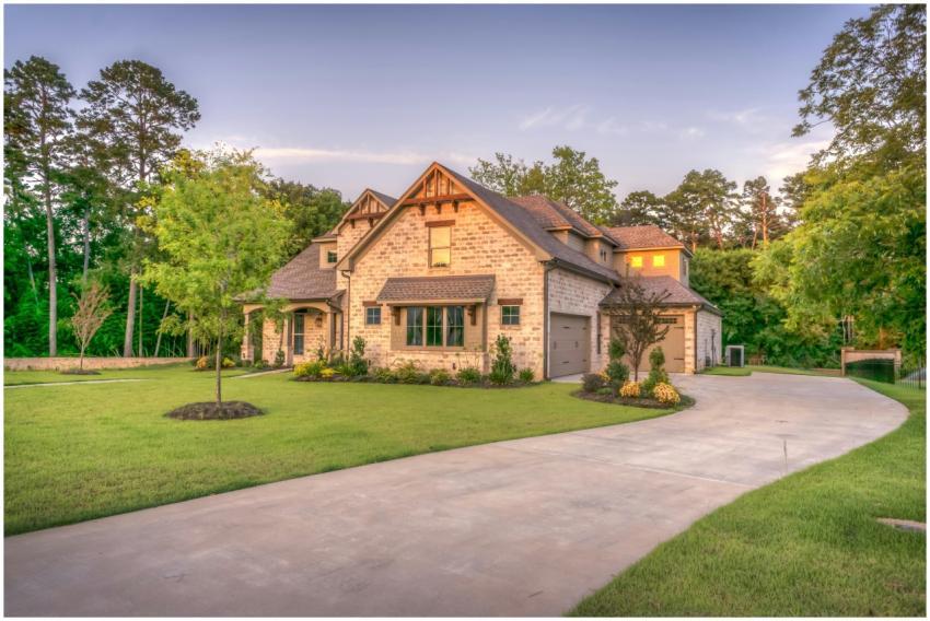 Elegant stone family home surrounded by trees, lus