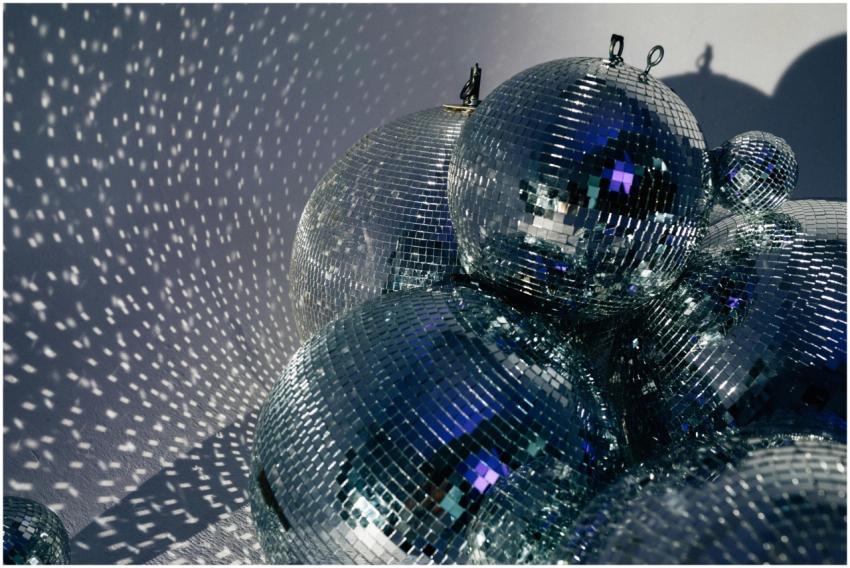 Cluster of disco balls casting shimmering reflecti
