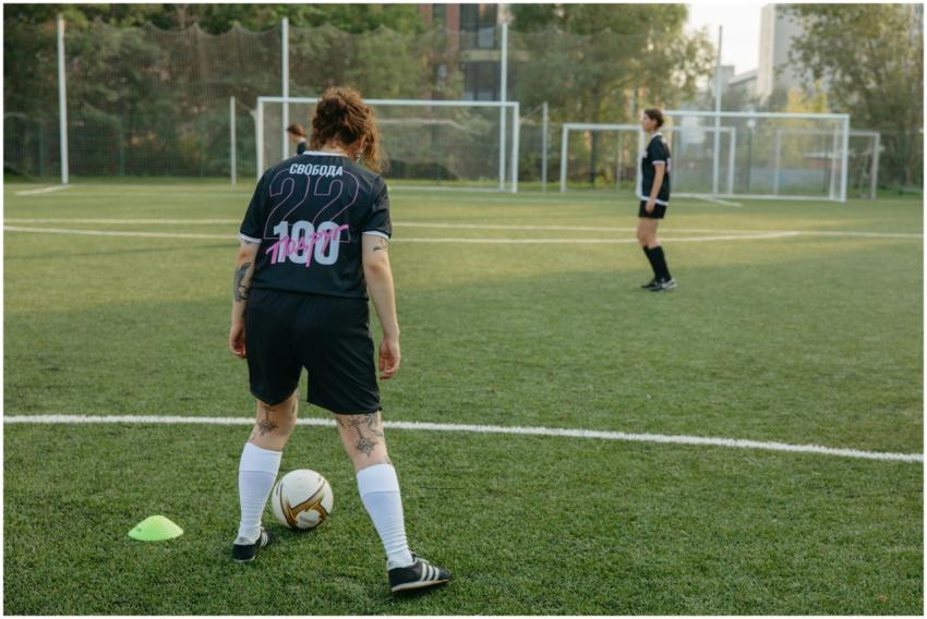 Female soccer players preparing for a match on a l