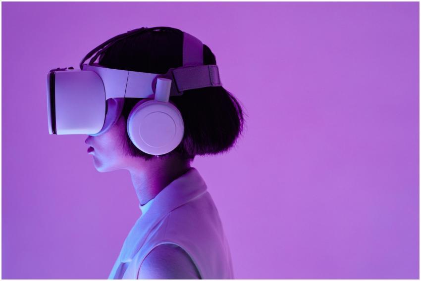 Side view of a woman wearing VR goggles in a purpl