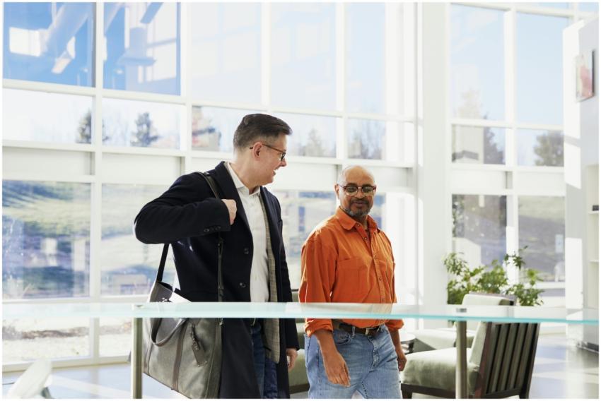 Two business professionals in a bright, modern off