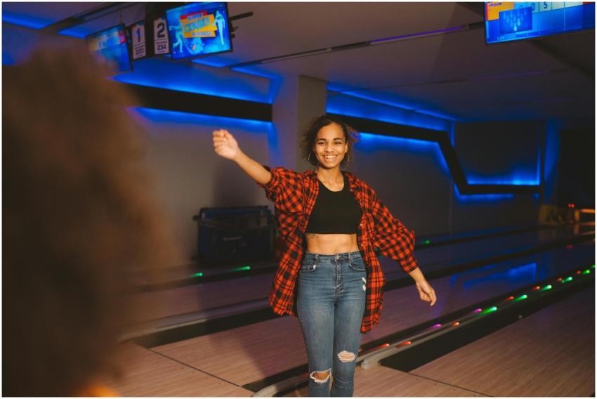 A cheerful woman celebrates while enjoying a fun n