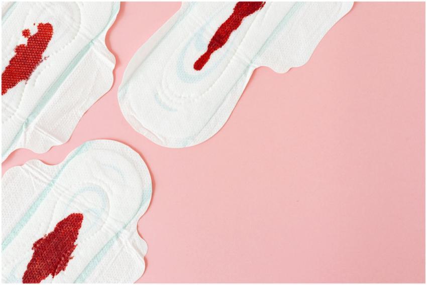 Flatlay of menstrual pads with visible blood stain