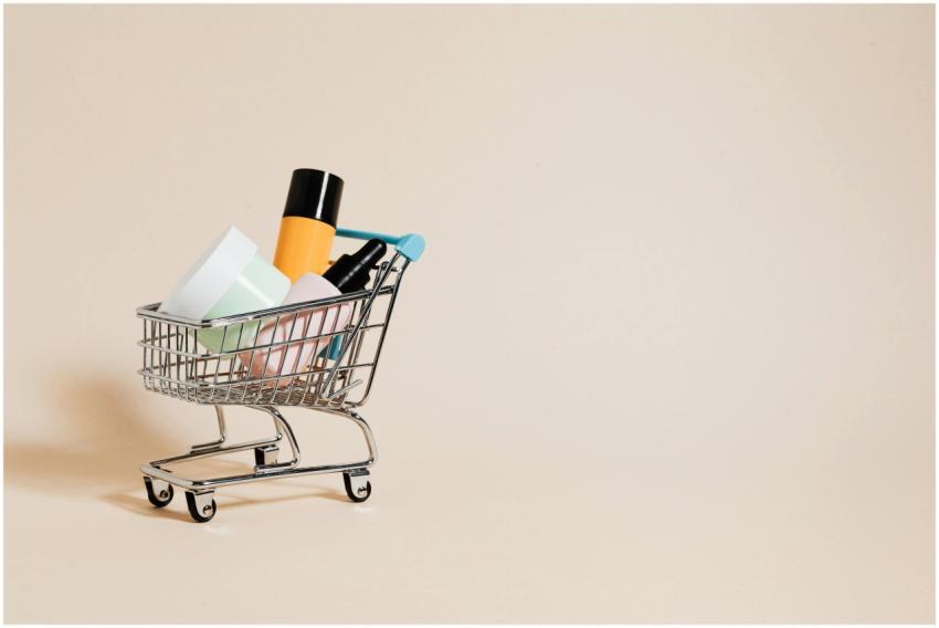 A minimalist image of a mini shopping cart filled