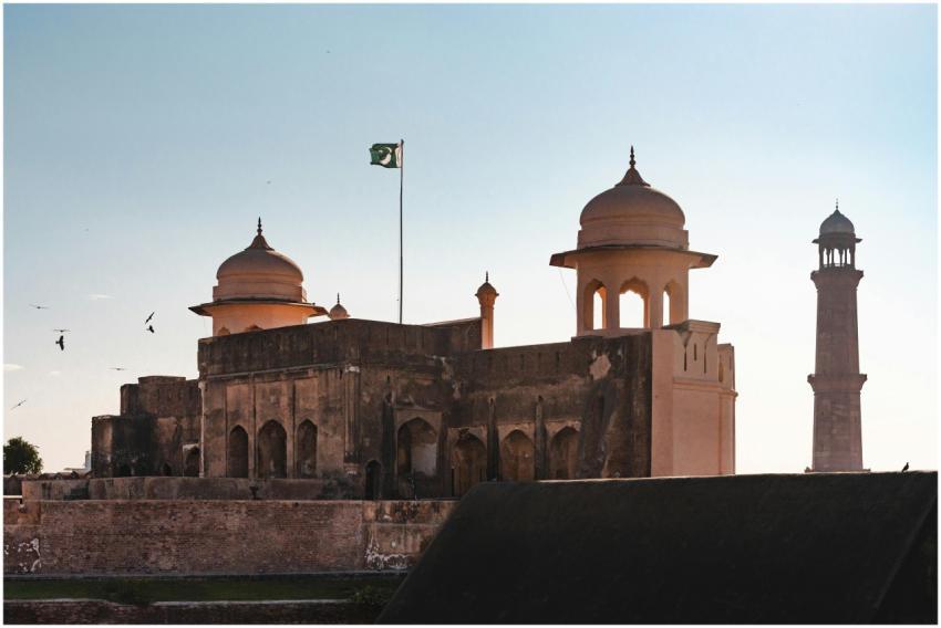 A view of Lahore Fort with a minaret silhouette ag