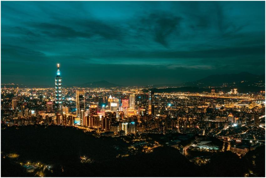 Vibrant night view of Taipei’s skyline featuring t