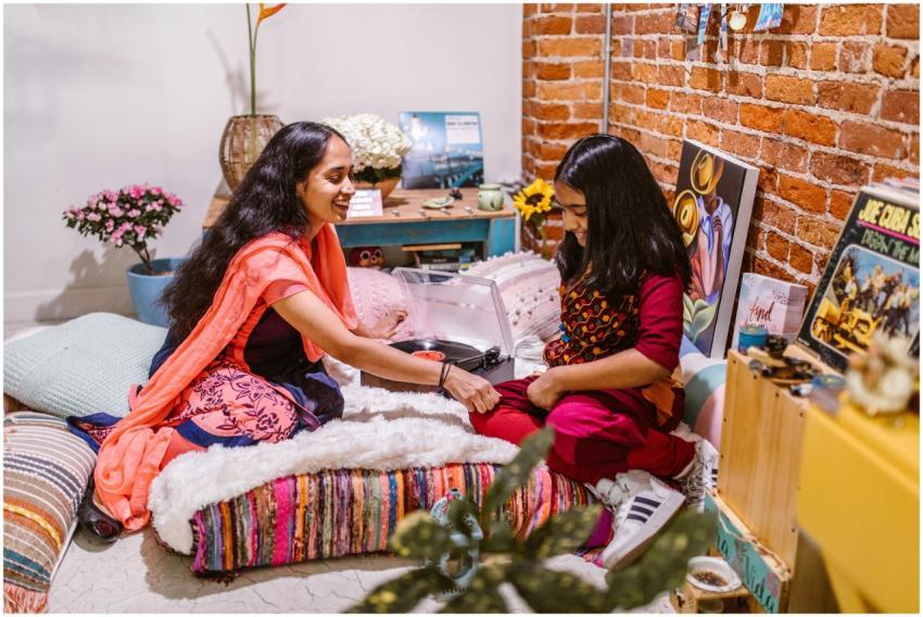 A joyful mother and daughter creating art together