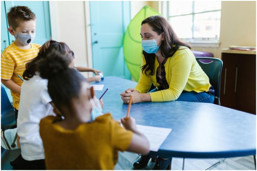 Teacher and students wearing masks in a classroom