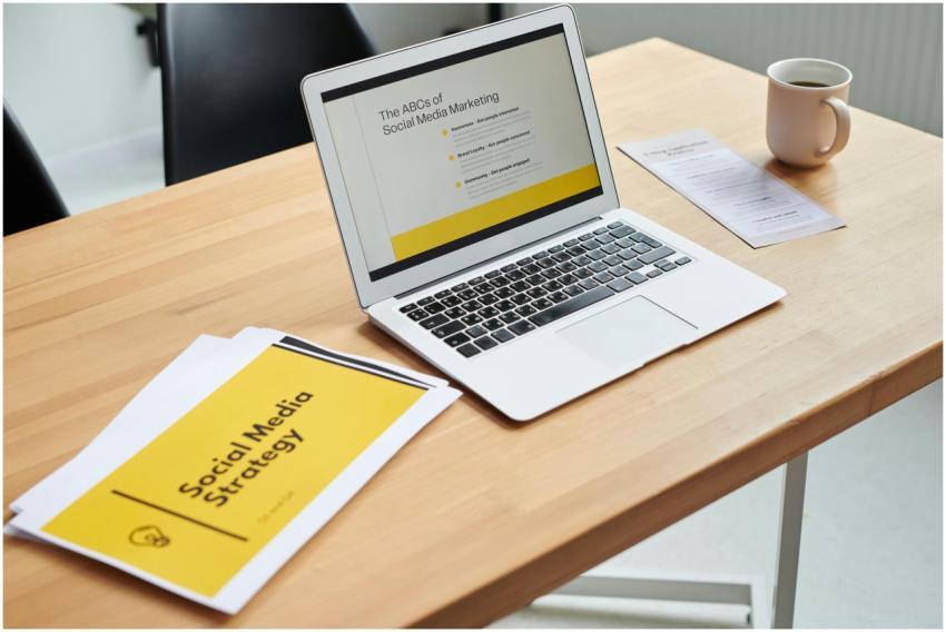 Close-up of a laptop showing a social media market