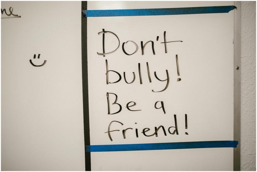 Message against bullying written on a whiteboard,