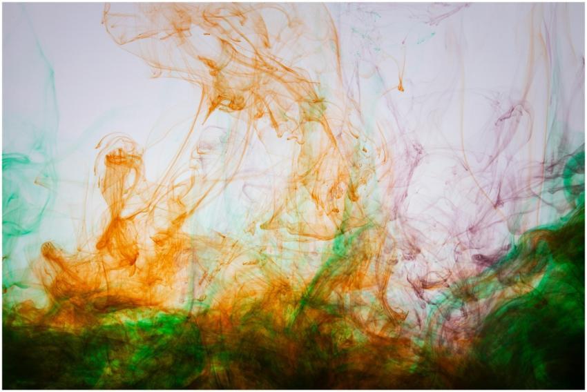 Vibrant swirling colors of ink in water create a m