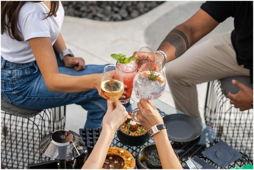 A group of friends clinking glasses with refreshin