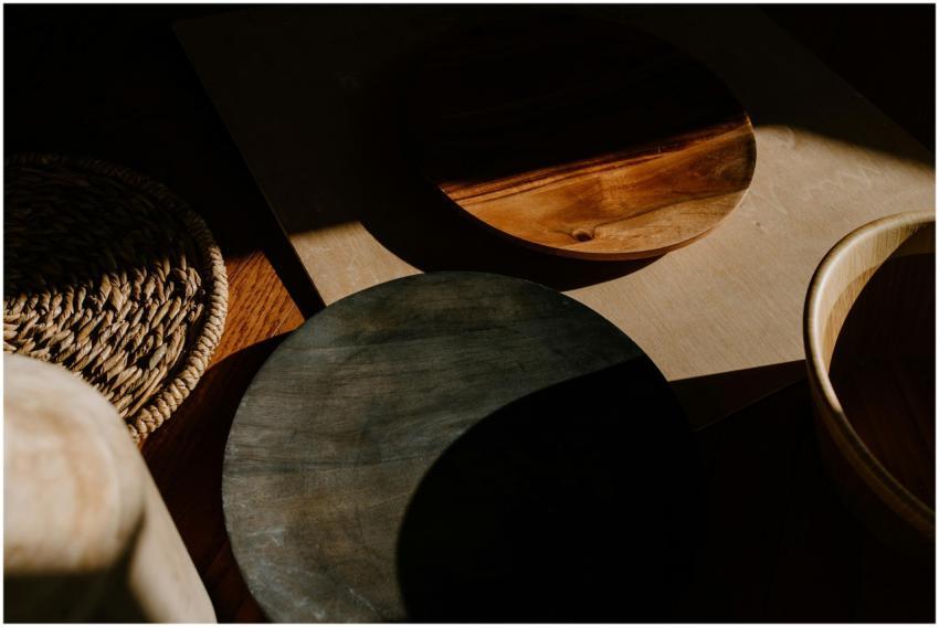 Artistic arrangement of wooden bowls showcasing sh