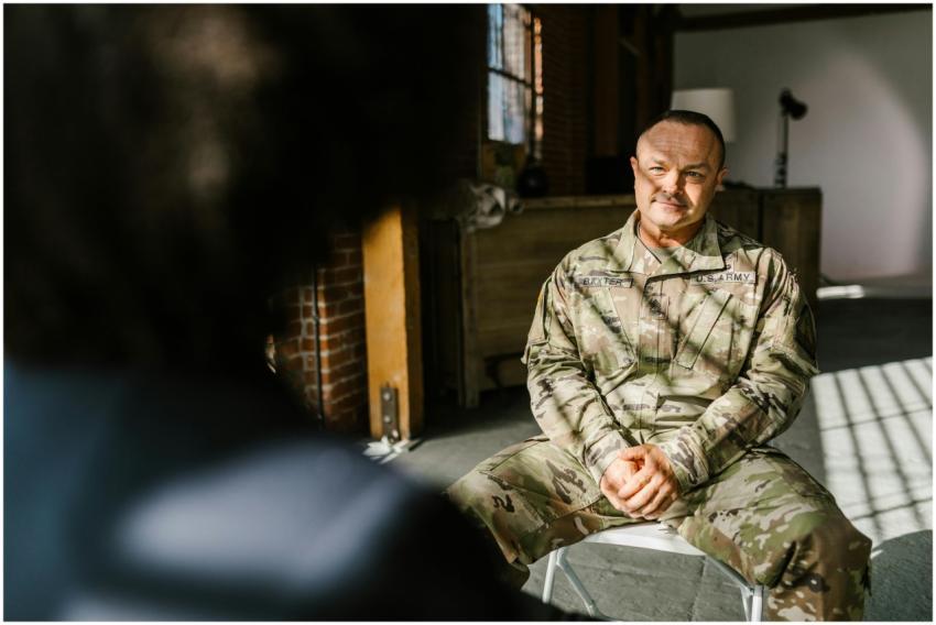 A U.S. Army soldier sits in therapy discussing men