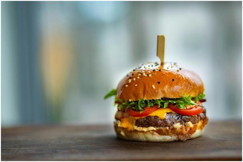 Mouthwatering cheeseburger with fresh tomatoes and