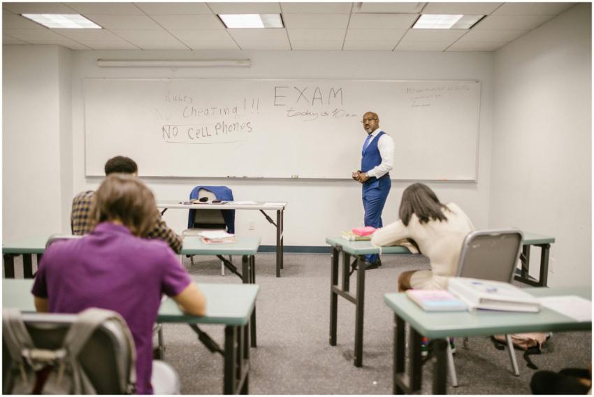 A college educator proctoring an exam, enforcing n