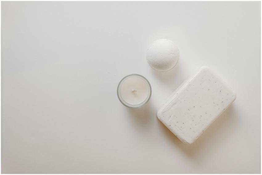 Flat lay of spa essentials, including soap, candle