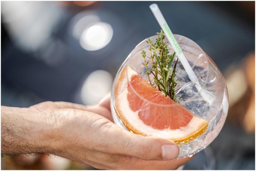 Close-up of a grapefruit cocktail with herbs in a