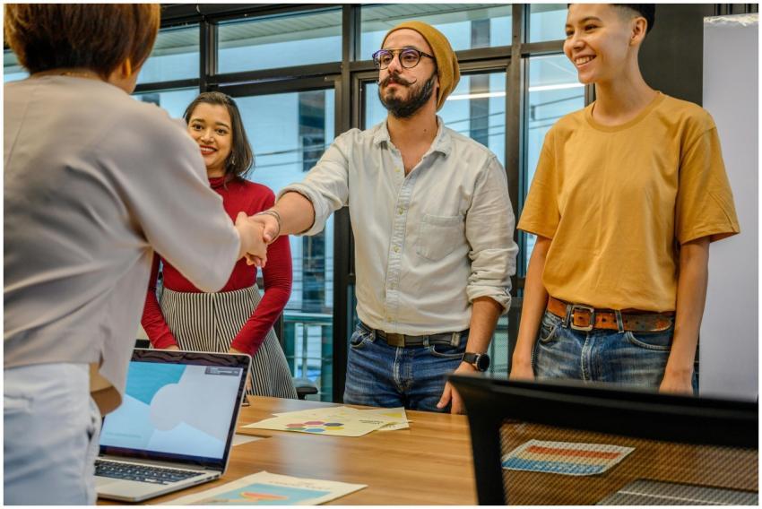 Colleagues shaking hands during a business meeting