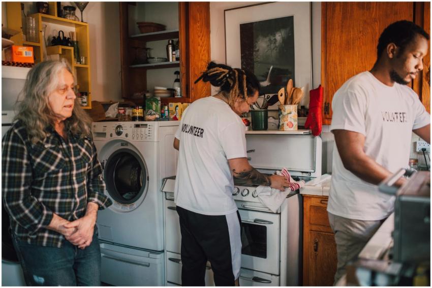 Volunteers preparing food in a community kitchen t