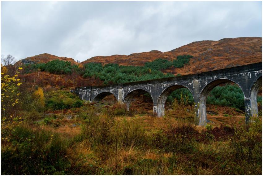 Majestic Glenfinnan Viaduct framed by autumn folia