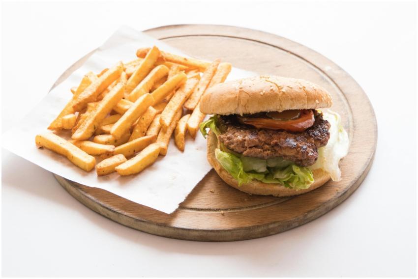 Delicious cheeseburger with fresh lettuce and toma