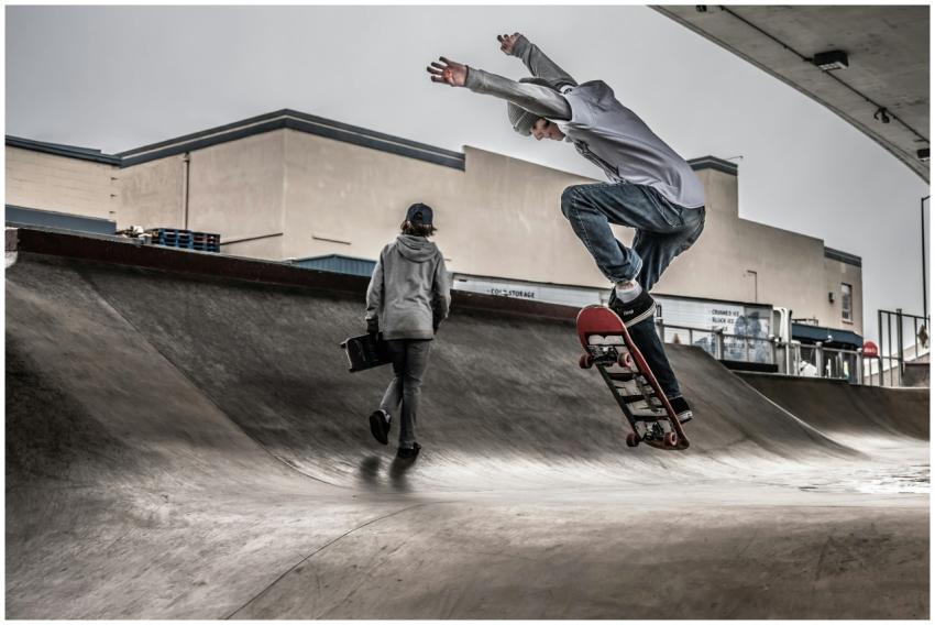 Skateboarder performing an airborne trick at a con