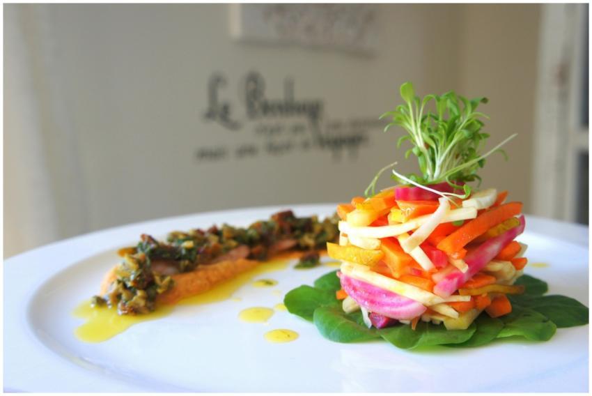 A vibrant stack of fresh vegetables artfully plate