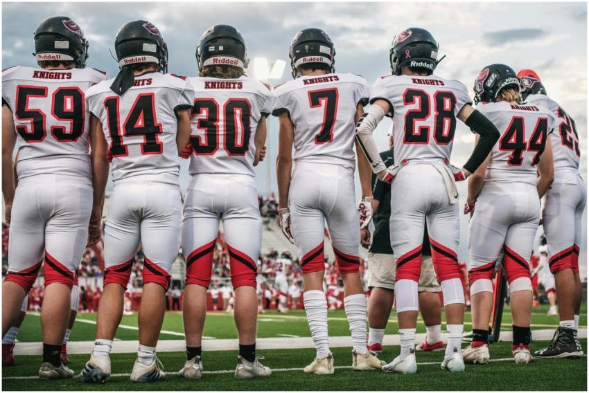 High school football team standing on the field re