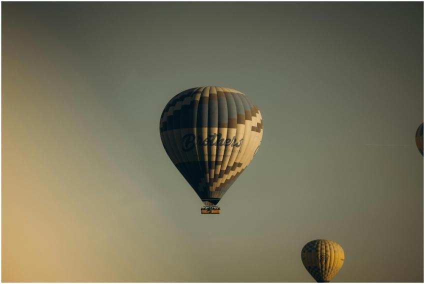 Hot air balloons gracefully flying over Cappadocia