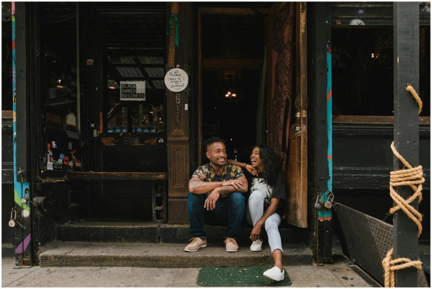 Friendly moment outside a black-owned café with tw