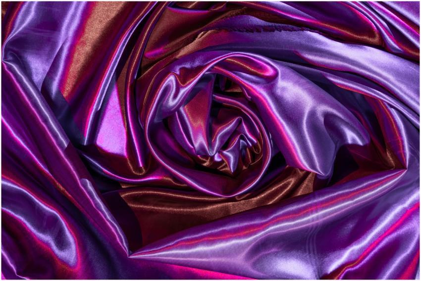 Abstract artistic image of swirling satin fabric w