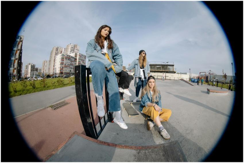 Group of skaters enjoying a sunny day at an urban
