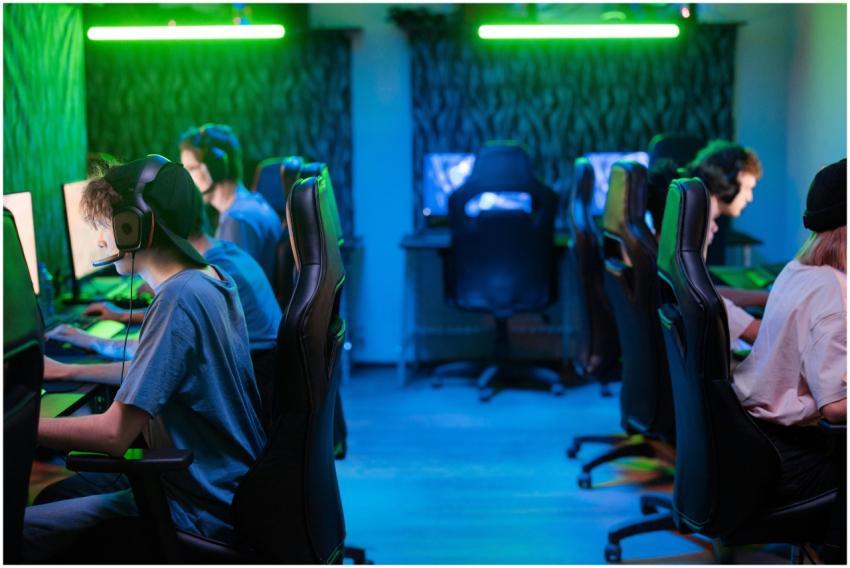 A vibrant gaming scene with a focused esports team