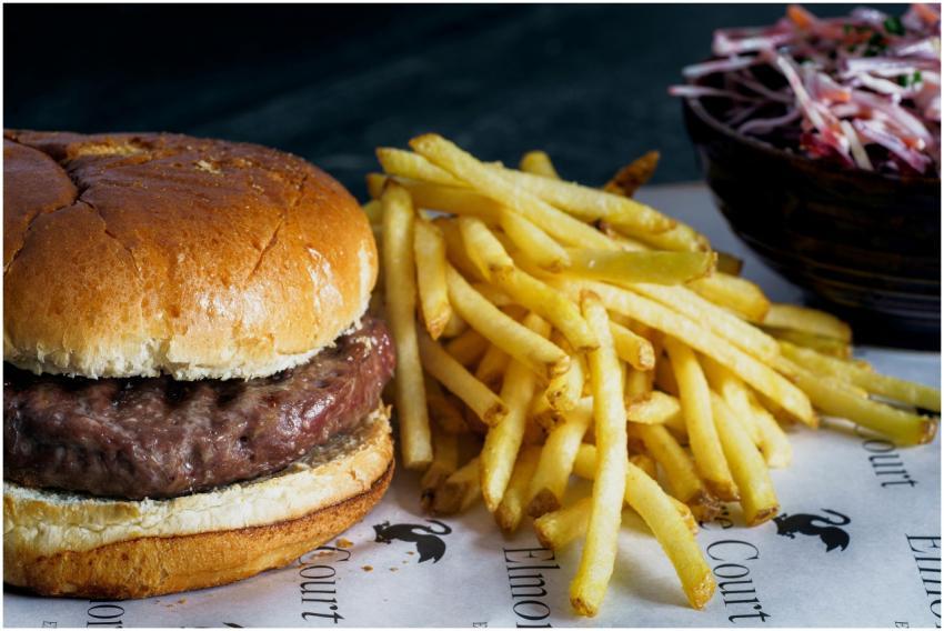 Mouth-watering beef burger with crispy fries, perf