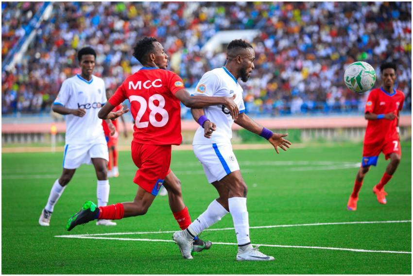 Soccer players competing fiercely during a match i