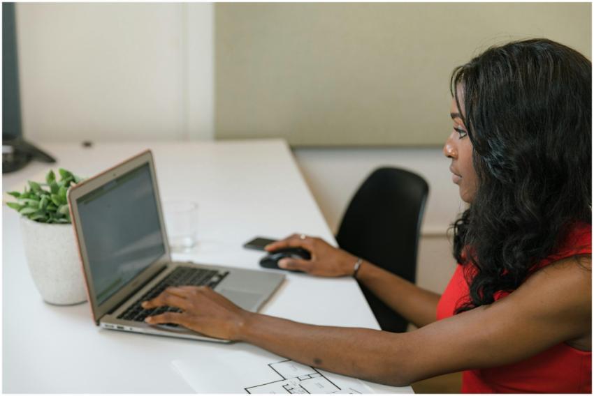 Professional woman working on a laptop at a modern