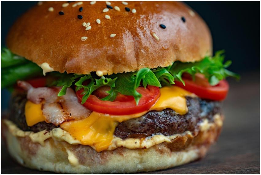 Juicy cheeseburger with bacon, lettuce, tomato, an