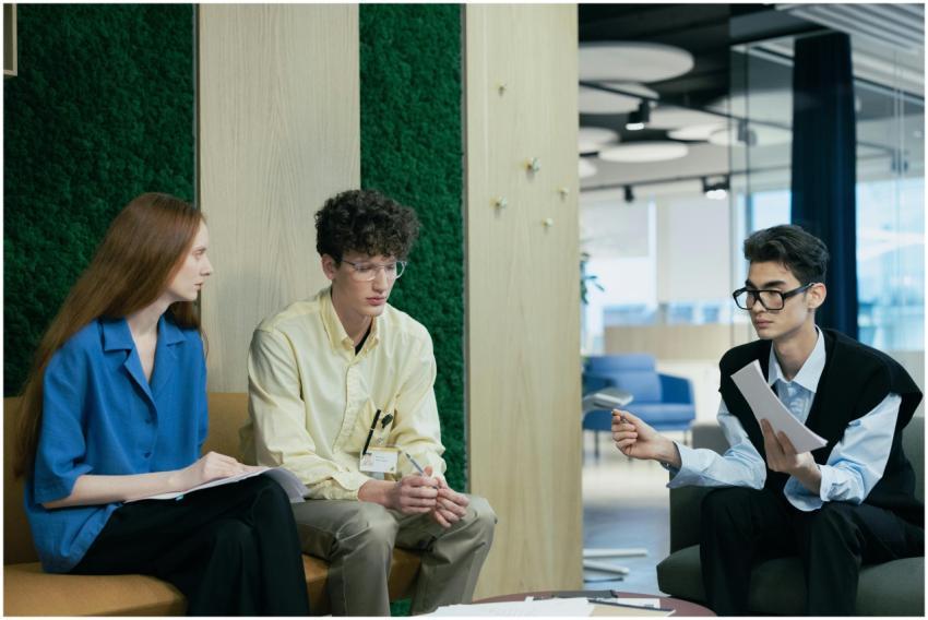 A diverse group of young professionals discussing