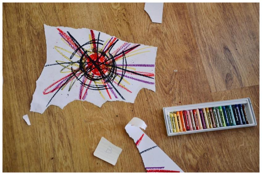 Colorful abstract art with oil pastels on wooden f