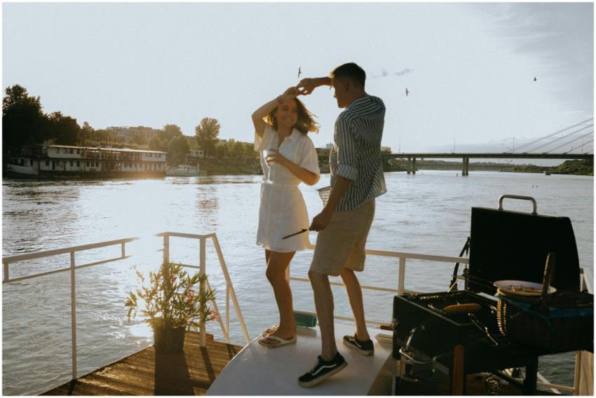 A couple enjoys a romantic dance on a yacht during