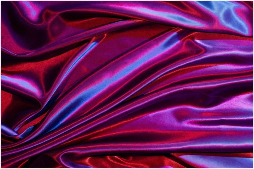 Luxurious red and purple satin fabric with vibrant