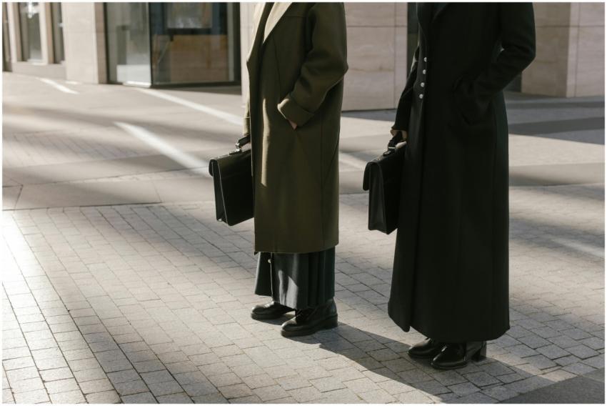 Two business professionals standing outdoors with