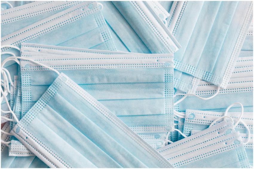 A detailed close-up of blue surgical face masks pi