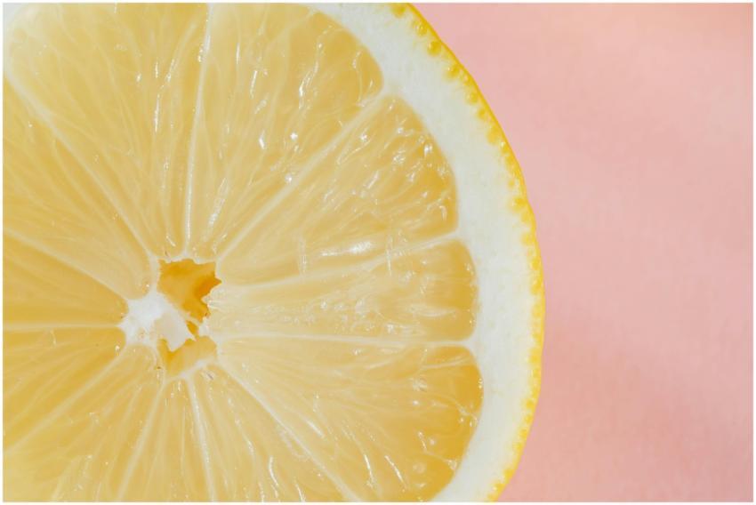 Closeup of slice of fresh juicy bright lemon place