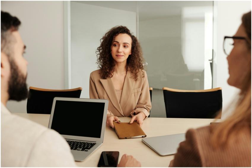 A woman in a business suit participates in a job i
