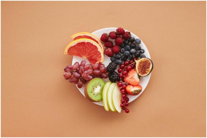 Colorful assortment of fresh fruits on a plate, pe