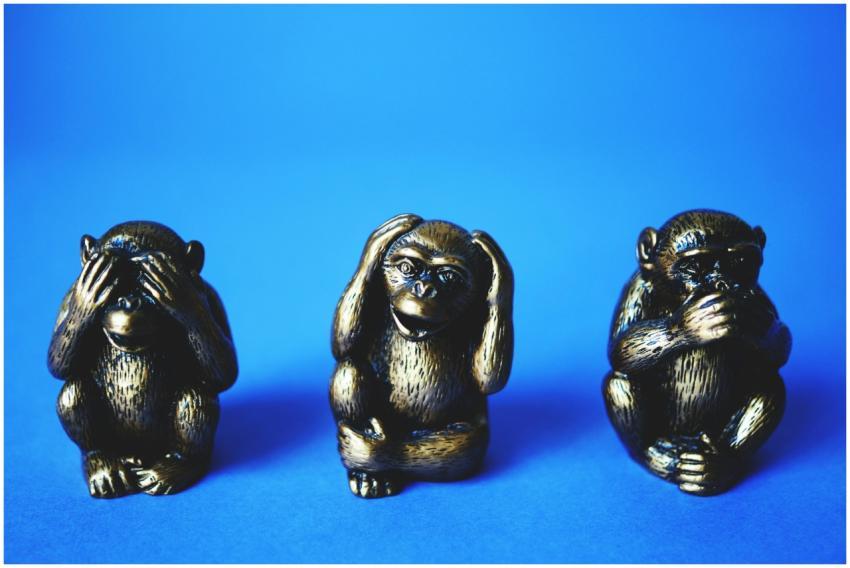 Close-up of the three wise monkeys bronze figurine
