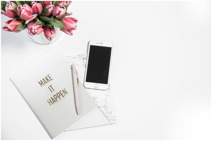 A minimalist desk setup featuring a smartphone, pi